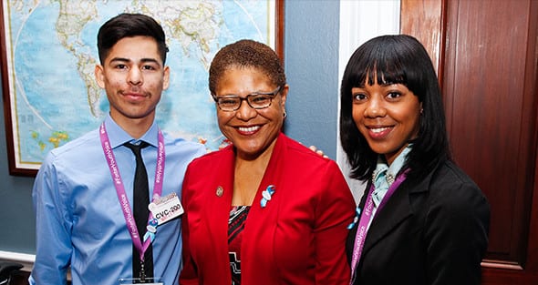 Ms. Bass of The National Foster Youth Institute with two Students