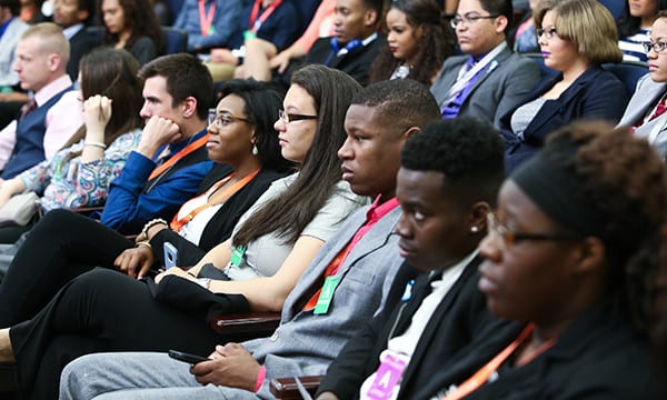 A Seated Audience Listens During an Event